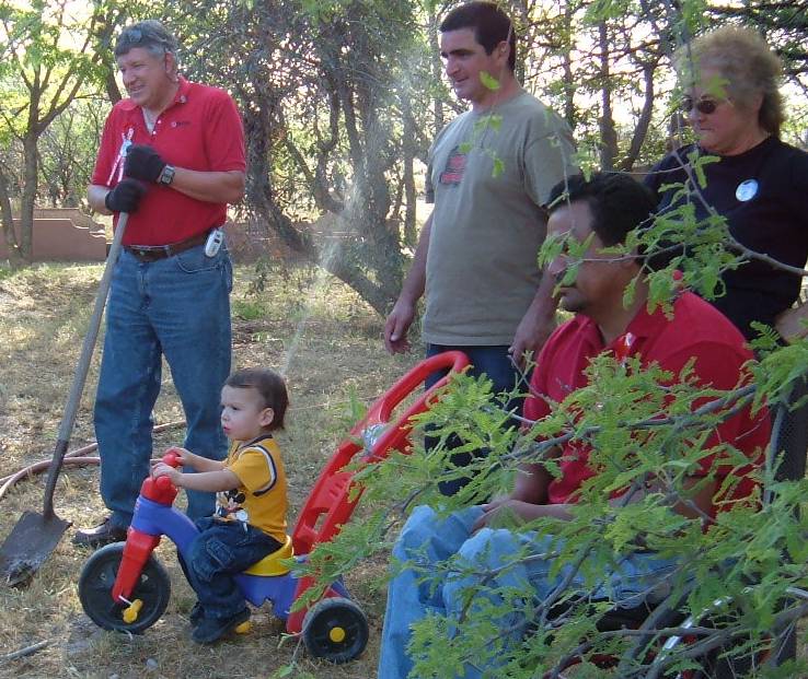 Phil Corrigan & little dude watch Desert Willow plant for Brian Corrigan